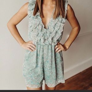 Storia Deep-V Ruffled Floral Romper